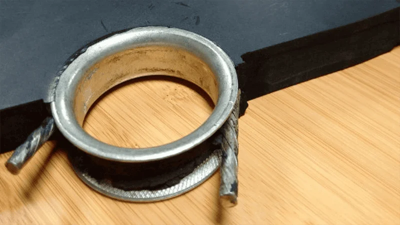 Close-up of a high-quality bumper plate showing the texture and steel insert