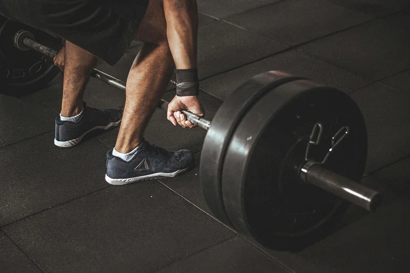 A close-up shot showing the standard colors of bumper plates stacked together