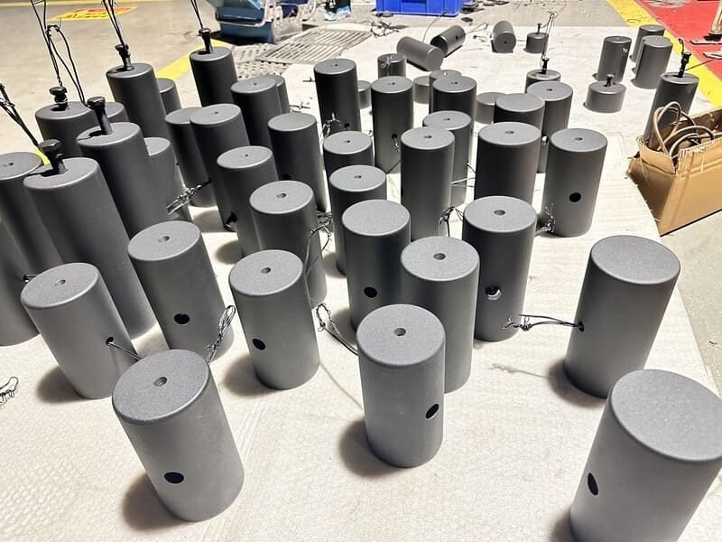 A collection of spare parts for gym equipment like cables, pins, and pads